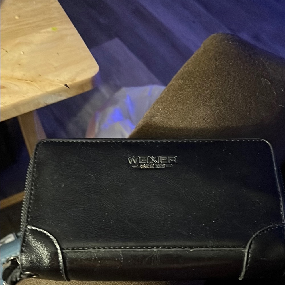 Black Plethor Wallet with Sleek Fold-Over Design